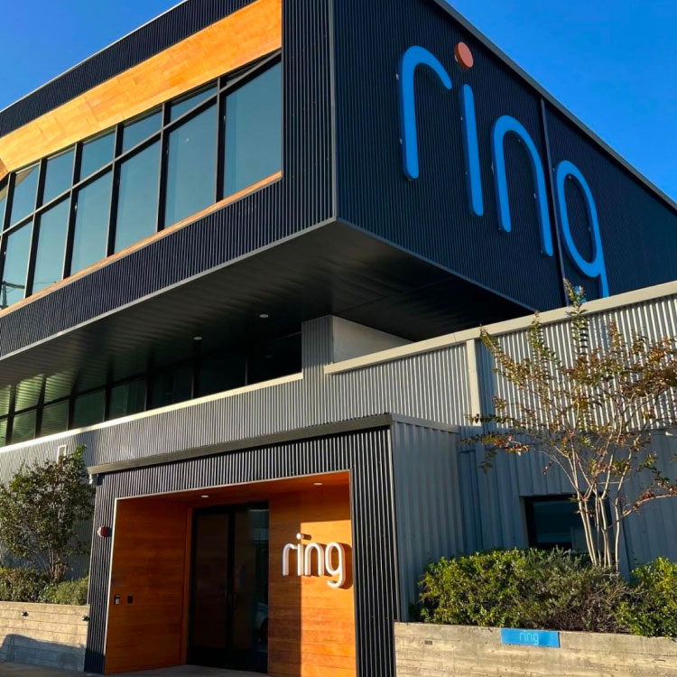 Side view of office building with Ring logo on it.