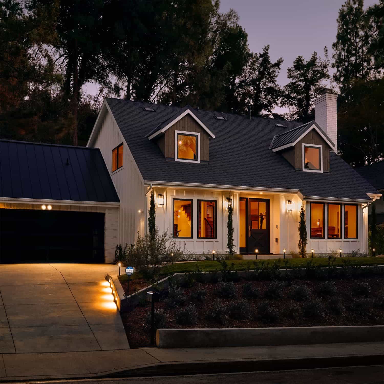Smart Lighting Spotlight Battery - Modern house at dusk lit by Ring Smart Lighting devices, including battery-powered Spotlight.