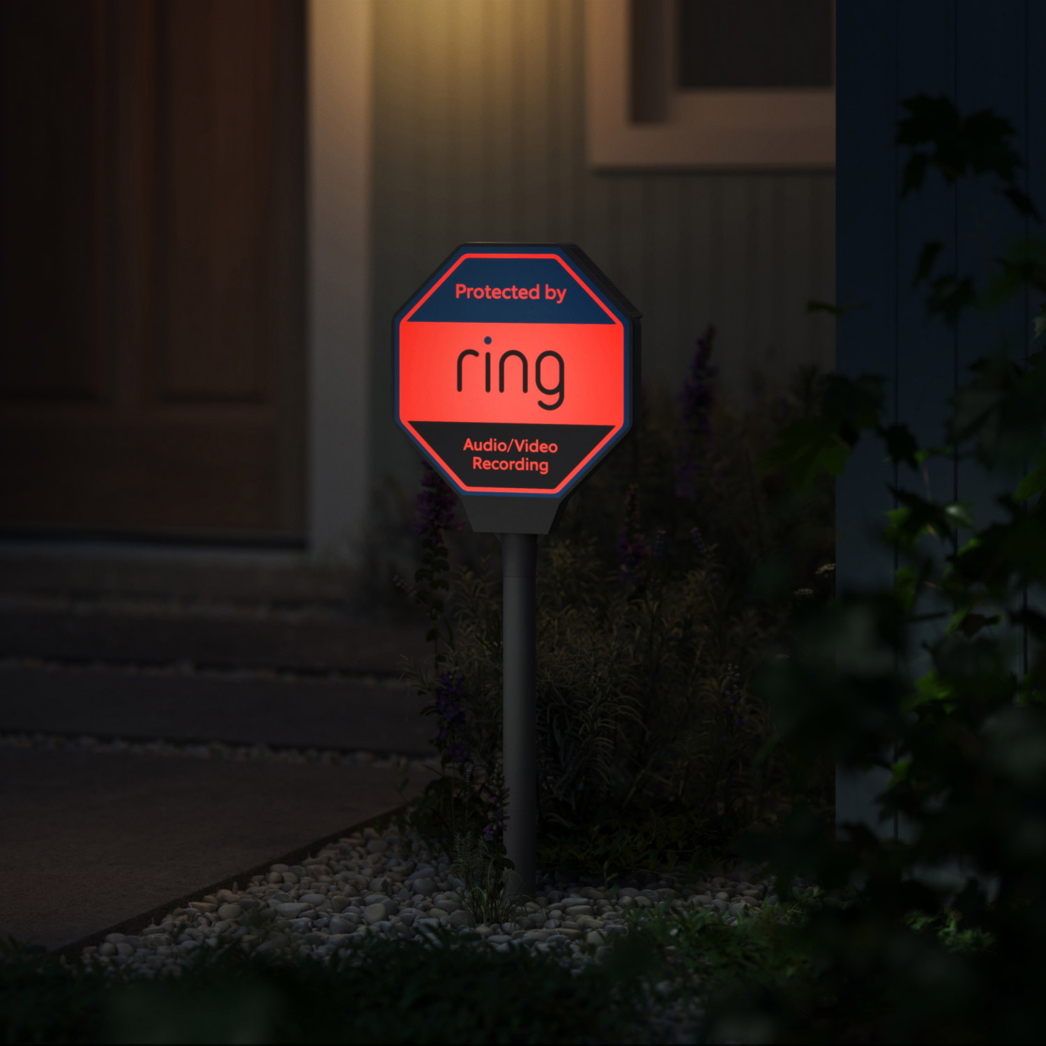 Ring Beacon - Ring Beacon illuminated red at night, showcasing the product's visibility and security features for home protection.