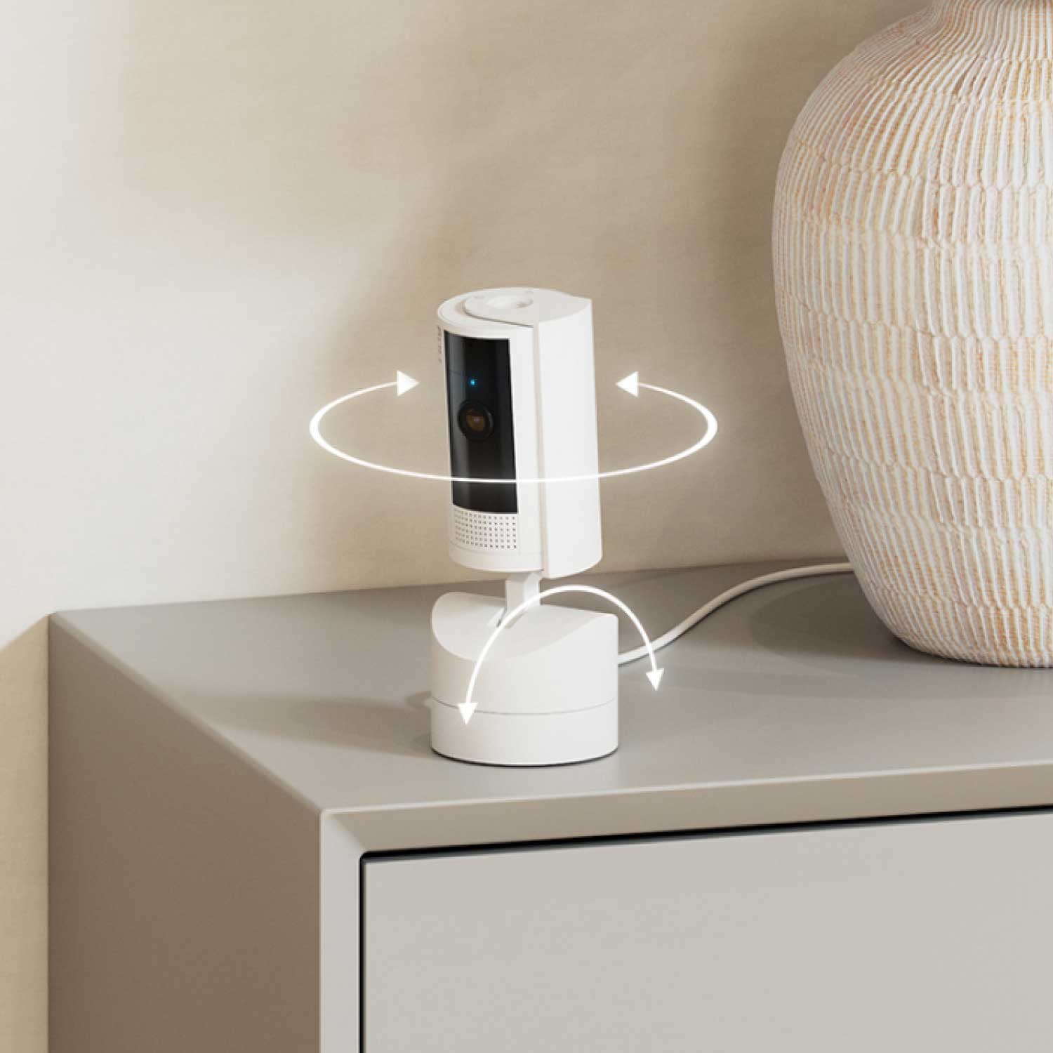 Outdoor Cam Plus Battery + Pan-Tilt Indoor Cam - Pan-Tilt Indoor Cam swiveling on a desk.