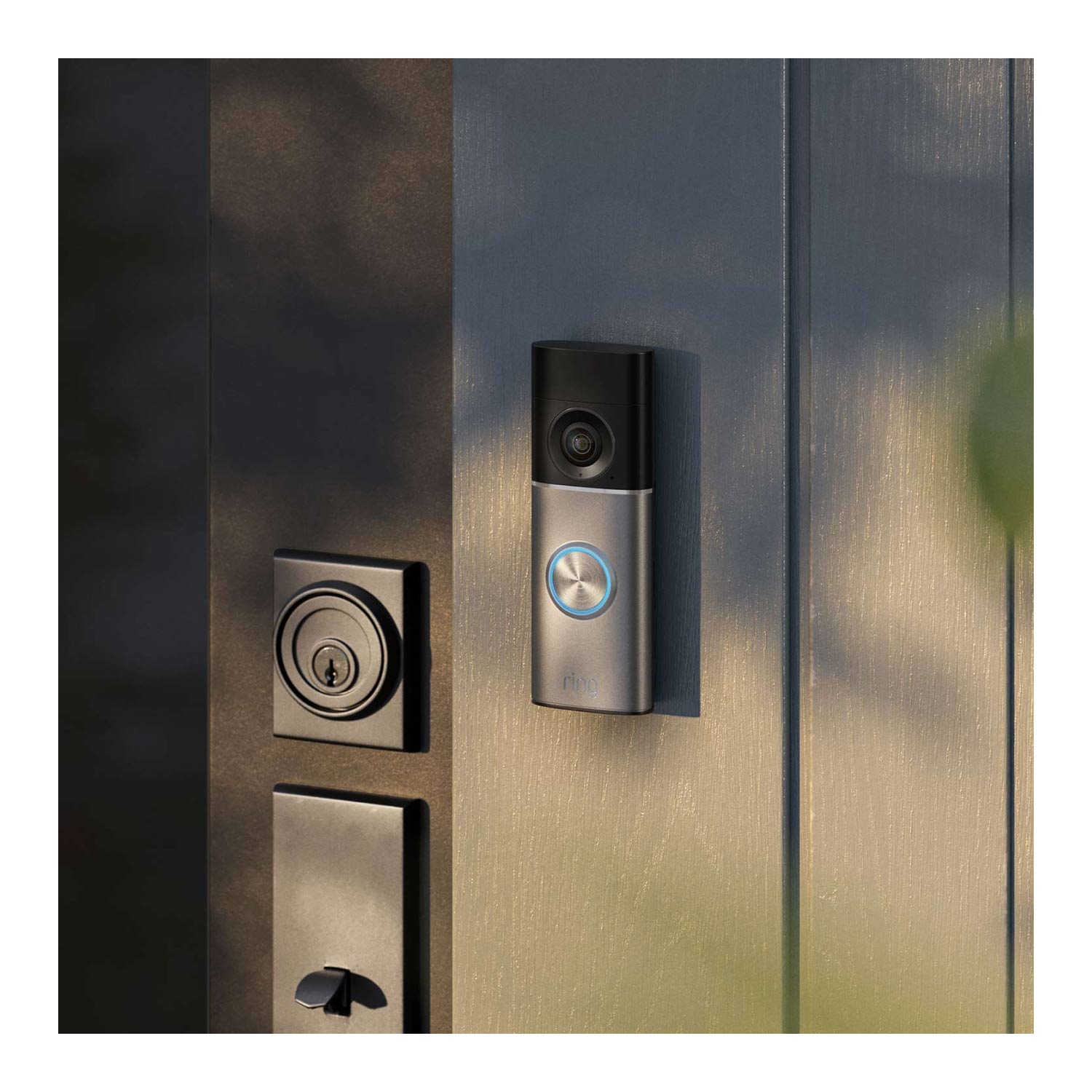 2-Pack Wired Doorbell Pro  (Newest Model) - Wired Doorbell Pro (2nd Gen) mounted on a dark wooden door next to a door lock, with natural lighting creating a subtle marbled shadow effect across the surface. 