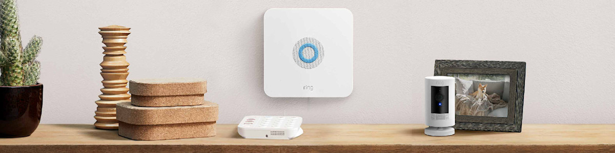 Ring security devices and Ring Alarm Base Station on wooden shelf
