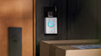 Ring Video Doorbell mounted on wooden door with parcels below